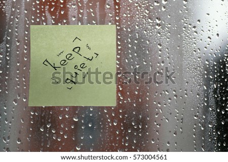 word on the glass with drops
