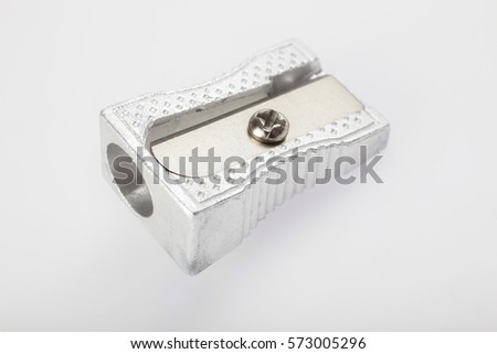 shinny close-up macro photo of sharpener showing all roughness of material with front in focus and rear blurred on white background