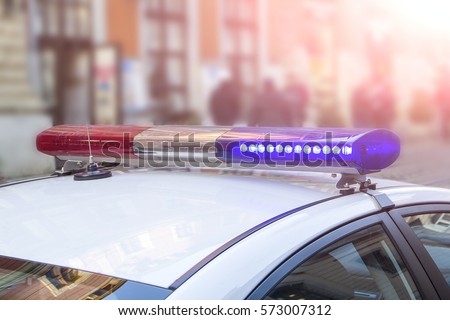 police light and siren on the car in the street Royalty-Free Stock Photo #573007312