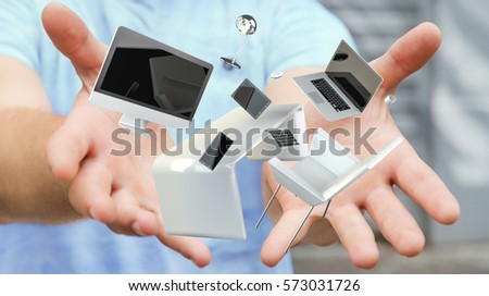Businessman on blurred background holding flying desk laptop phone and tablet in his hand 3D rendering