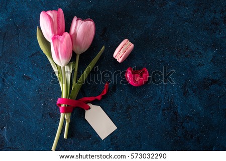 pink tulip flowers and notes paper on blue rustic , breakfast on Mothers day or Women day