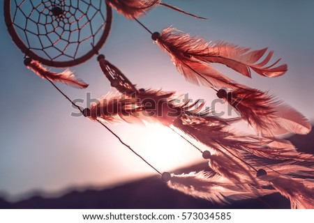 Dreamcatcher sunset , the mountains, boho chic, ethnic amulet,symbol Royalty-Free Stock Photo #573034585