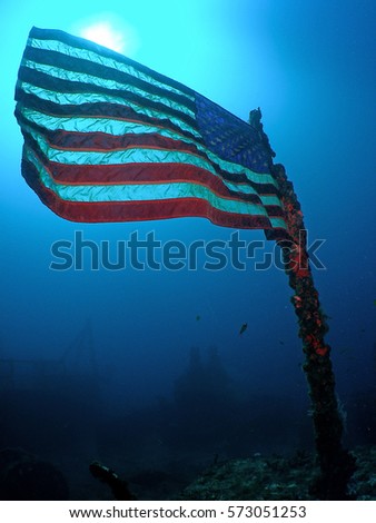 Underwater Flag on the USCG Duane in Key Largo Royalty-Free Stock Photo #573051253