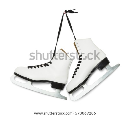 Pair of Figure Ice Skates Hanging Isolated on White Background. Royalty-Free Stock Photo #573069286