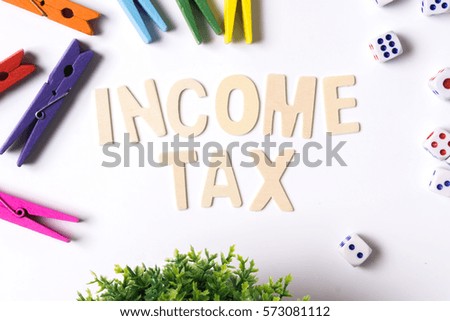 Concept income tax word title over white background 