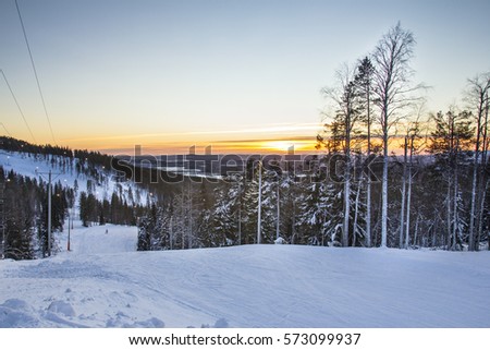 Beautiful cold mountain view of ski resort, a wintry landscape. Photographed in Levi in Finnish Lapland at sunrise.