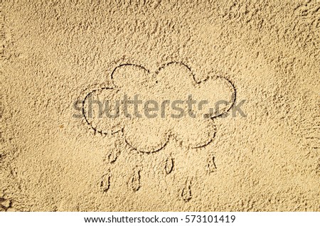 Top view of sandy beach with drawing in the sand or symbol. Background with copy space and visible sand texture.