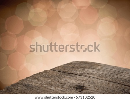 Perspective rustic wood over abstract blurred lights, ready for product montage