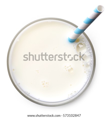 Glass of milk with straw isolated on white background. From top view Royalty-Free Stock Photo #573102847