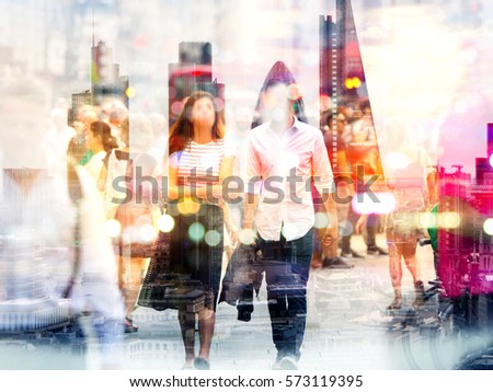 Silhouettes of young couple walking in London against of sunset. Multiple exposure image. Romantic concept illustration.
