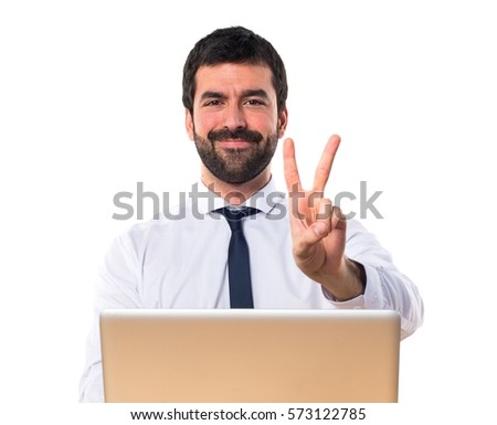 Businessman in his office counting two