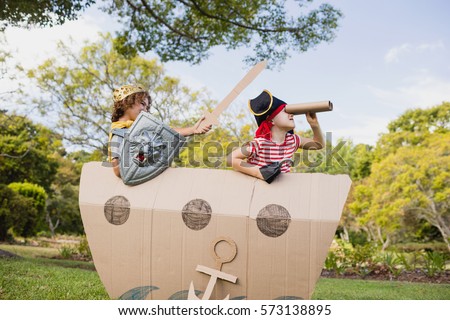 Two friends playing and dressing up in the park