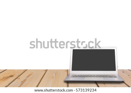 Laptop with blank screen on wooden table with white background, can used for display or montage your products
