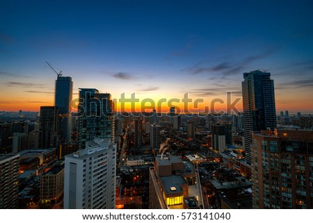 A brilliant sunrise in a city filled with high rises