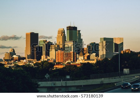 Downtown Minneapolis draped in the light of the last sunset of summer.