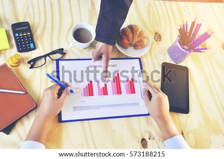 Manager hand pointing at business document during discussion at her desk ,business concept ,
