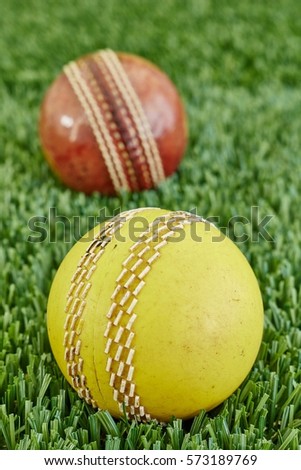 A studio photo of cricket gear on grass