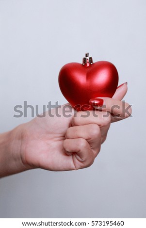 Woman hands with red heart . Space for text. Concept Valentines Day art design.