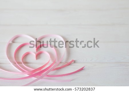 Valentines day card concept- heart made of ribbon on white background