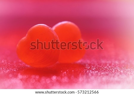 Valentine's Day is celebrated on February 14. It is a festival of romantic love and many people give cards, roses and letter. Selective focus and toned image. Both of heart candy.