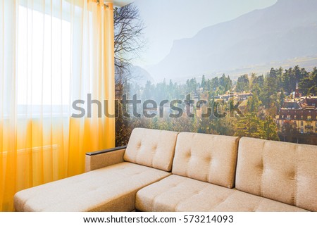 The interior of the living room in orange tones with sofa