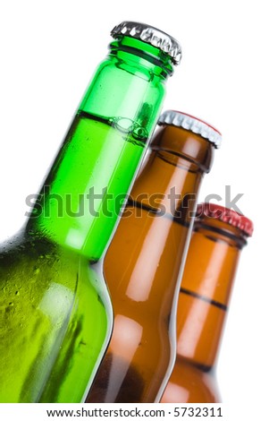 Three beer bottles against white background