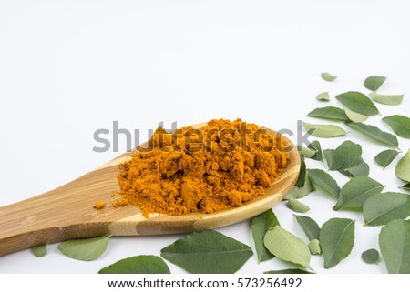 preparation of materials based curry main dishes consisted of curry leaves and curry powder set in concept studio isolated white background. Curry leave,curry powder and bamboo ladle