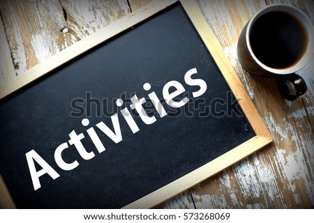 Activities word written on black blackboard and a cup of coffee-motivational concept