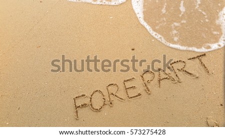 Handwriting words "FOREPART" on sand of beach