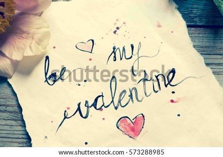 Be my valentine - handwriting watercolor on a paper/toned photo