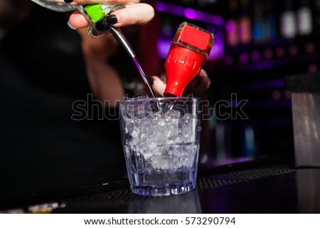 Bartender is preparing a cocktail
