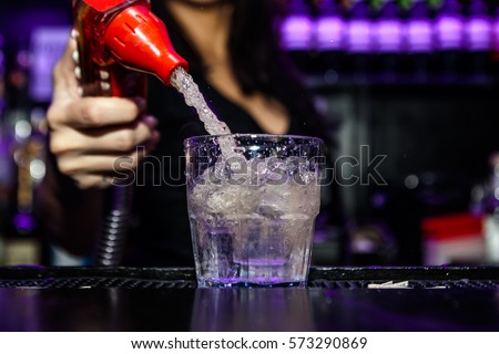 Bartender is preparing a cocktail