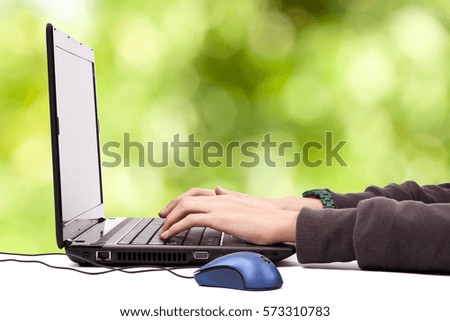 hand writing in the computer laptop on background natural