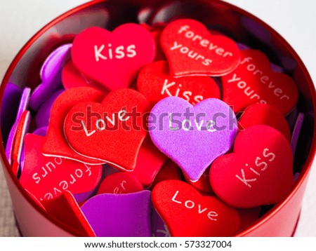 red and purple hearts in a red box