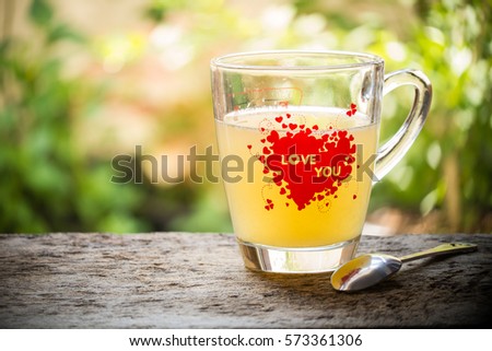 Hot lemon honey water on the table with nature background