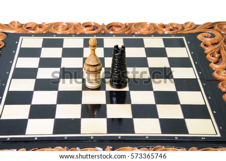 The chess pieces are placed on the chessboard. Defeated black king. The player admitted defeat