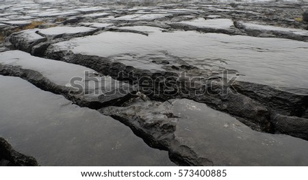 pristine landscape of black rocks Irish west coast with a history of three hundred million years