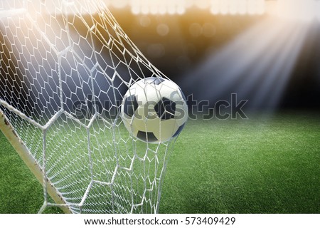 soccer ball in goal Royalty-Free Stock Photo #573409429