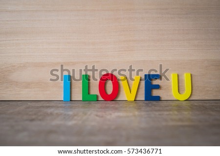 Colorful word love on wooden floor , Valentine concept