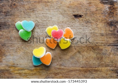 Heart shaped jelly on the wooden floor
