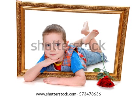 Little boy with a rose lying inside the frame of the picture
