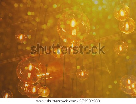 blur hanging lamp on golden bokeh background