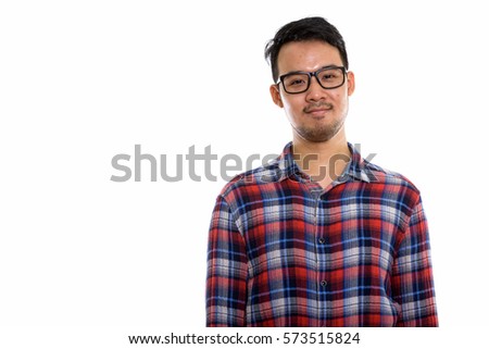 Studio shot of young Asian man wearing eyeglasses