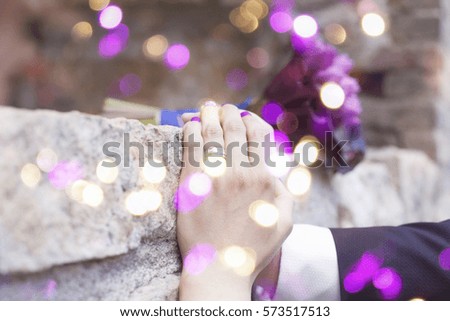Bride and groom holding hands, love background