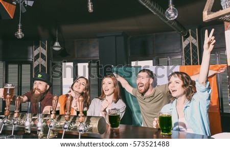 People celebrating Saint Patrick's Day in pub