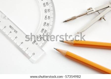 Drawing material - pencils,trammel,protractor on white background