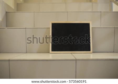 blackboard placed on stairs.