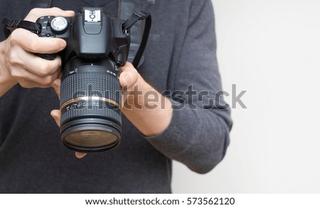 photographer hands holding camera
