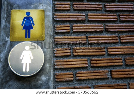 public toilet signs of woman
