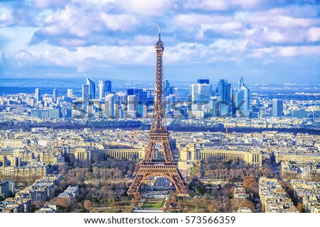 Paris cityscape. Aerial view of the main attractions of Paris Eiffel Tower on background of business district of La Defense, seen from Montparnasse skyscraper, France. Royalty-Free Stock Photo #573566359